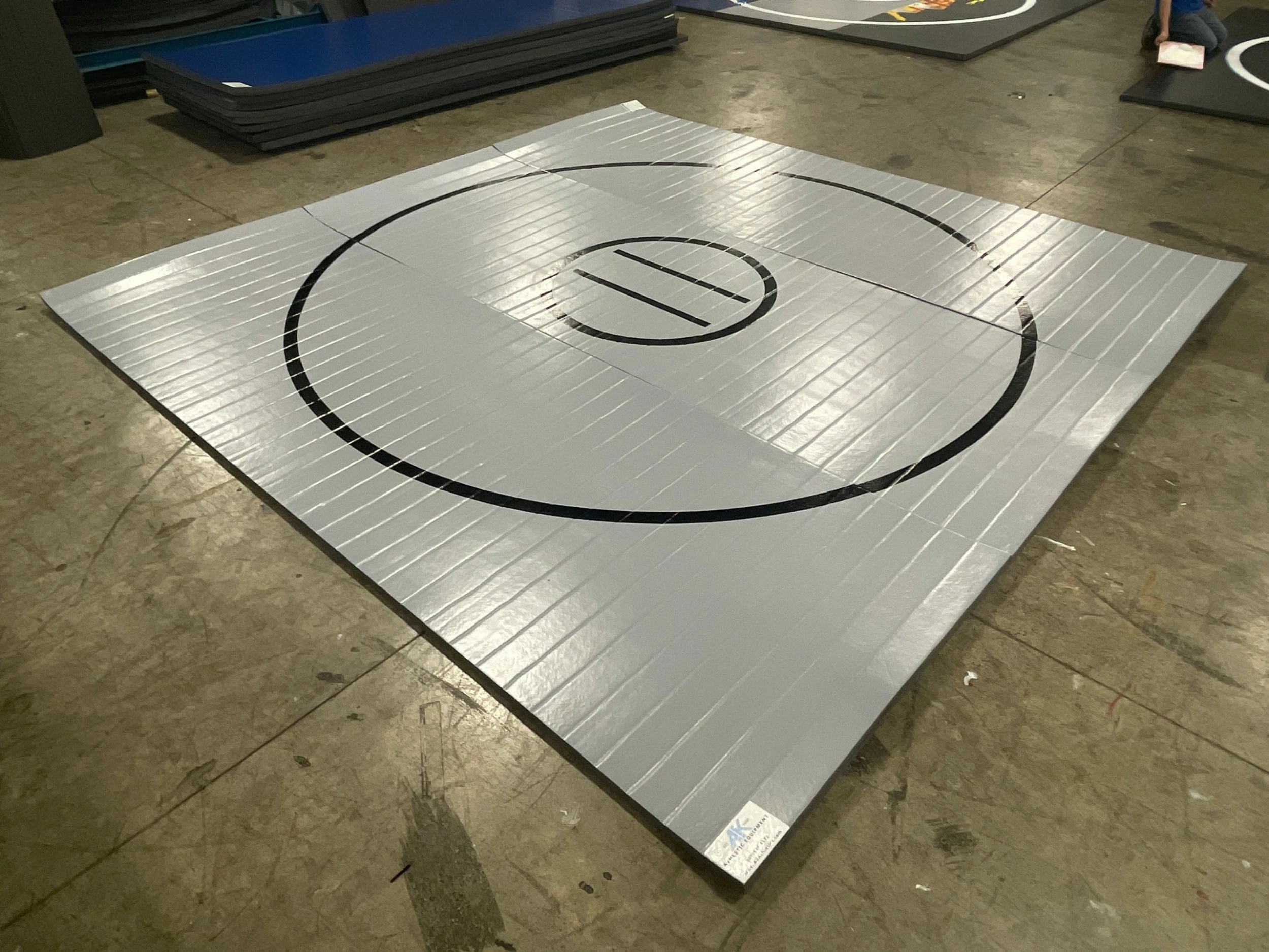 AK Athletic Equipment Clearance Wrestling Mat 12' X 12' X 1 3/8" Roll-Up Mat Gray With Black Lines 1 AK Athletic Equipment Clearance Wrestling Mat 12' X 12' X 1 3/8" Roll-Up Mat Gray With Black Lines