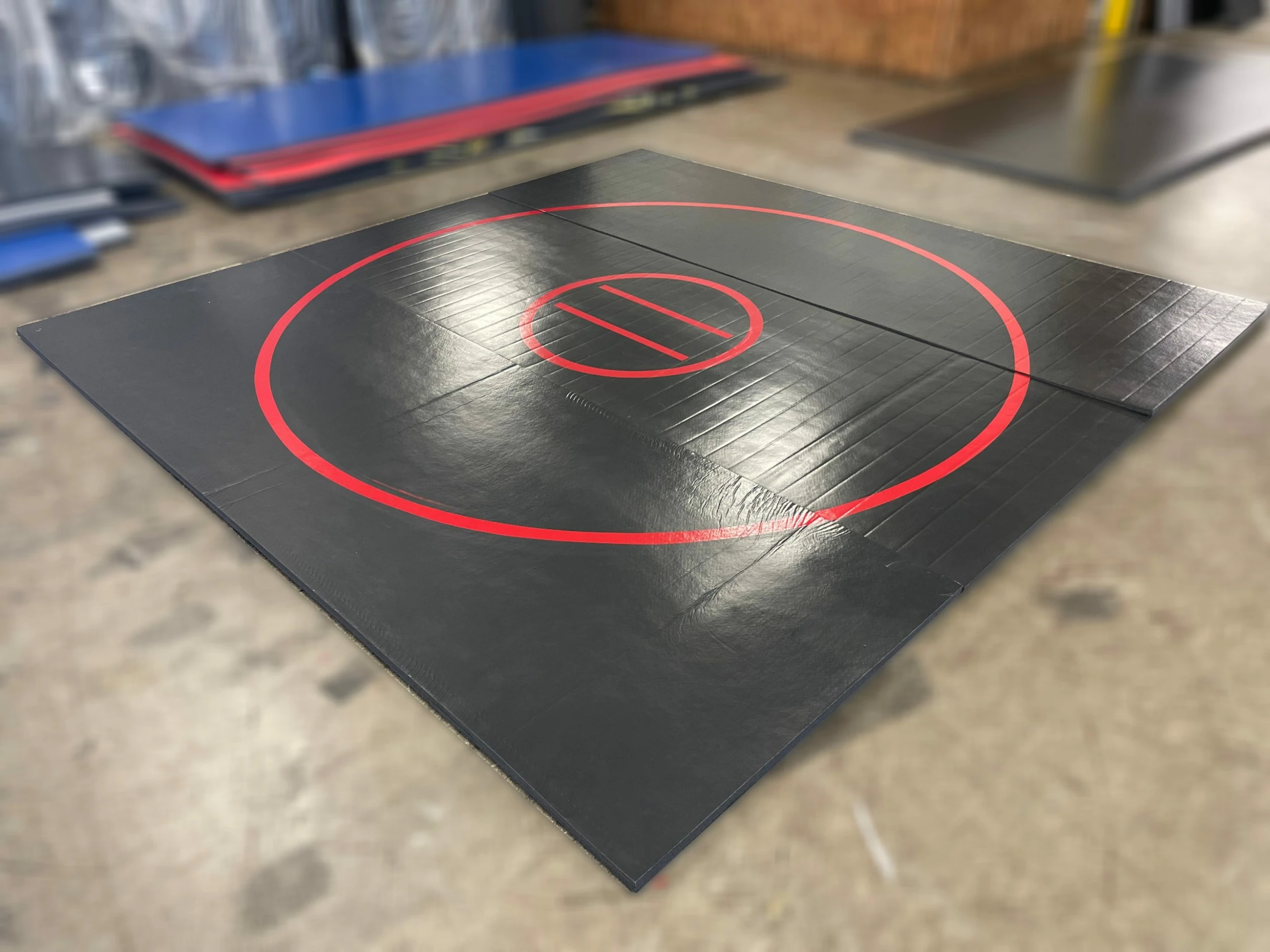 AK Athletic Equipment Clearance Wrestling Mat 12' X 12' X 1 3/8" Roll-Up Mat Black With Red Circles 1 AK Athletic Equipment Clearance Wrestling Mat 12' X 12' X 1 3/8" Roll-Up Mat Black With Red Circles